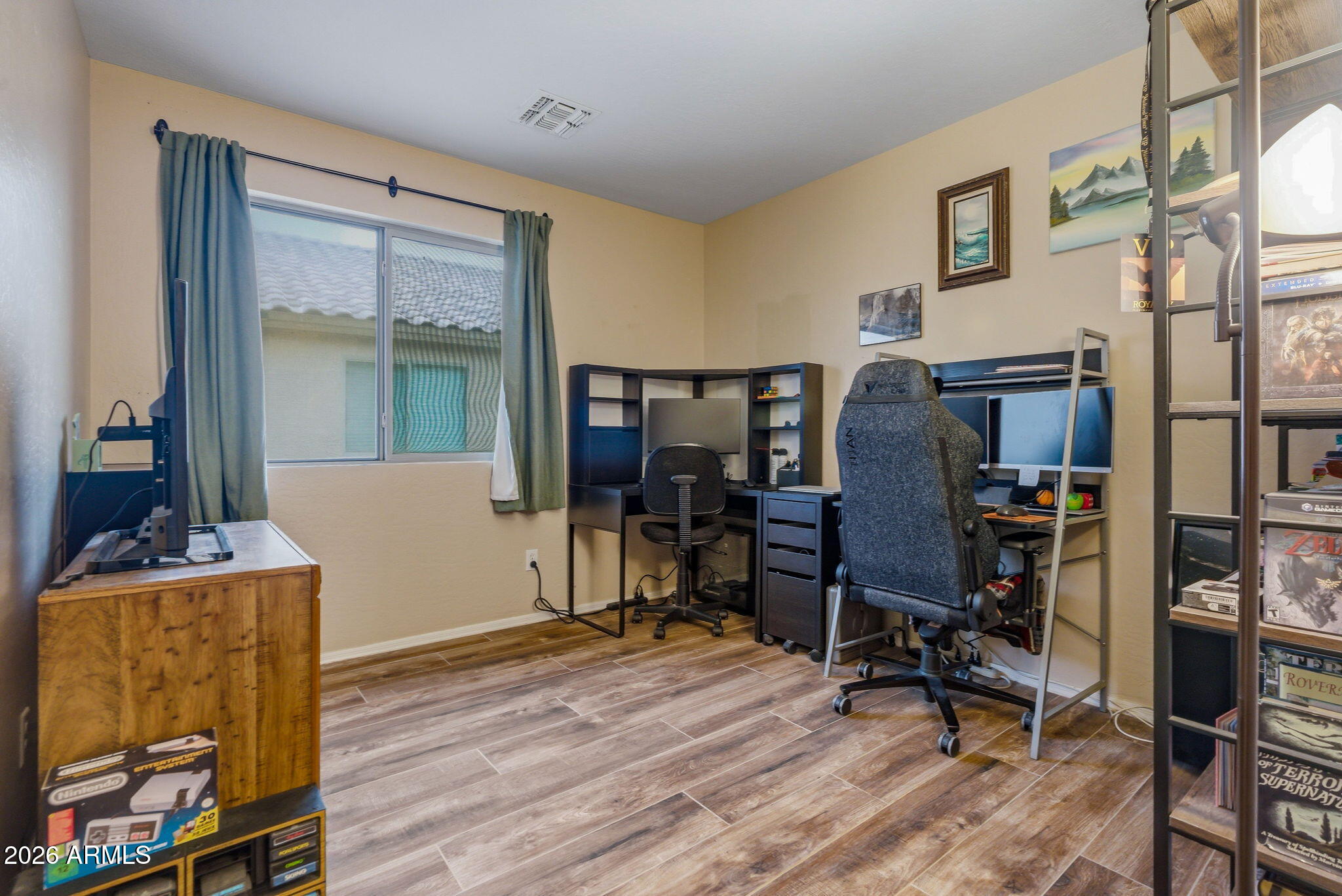 15843 West Washington Street Goodyear, AZ 85338 - Photo 21 of 39 a view of a workspace with furniture and a window