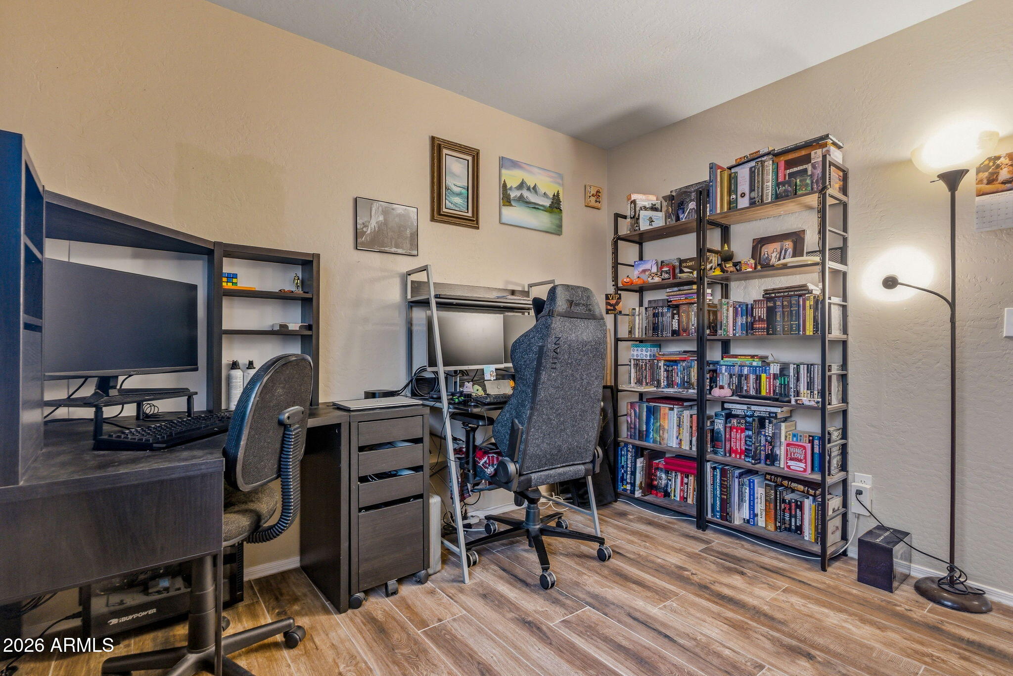 15843 West Washington Street Goodyear, AZ 85338 - Photo 22 of 39 a view of a workspace with furniture and wooden floor