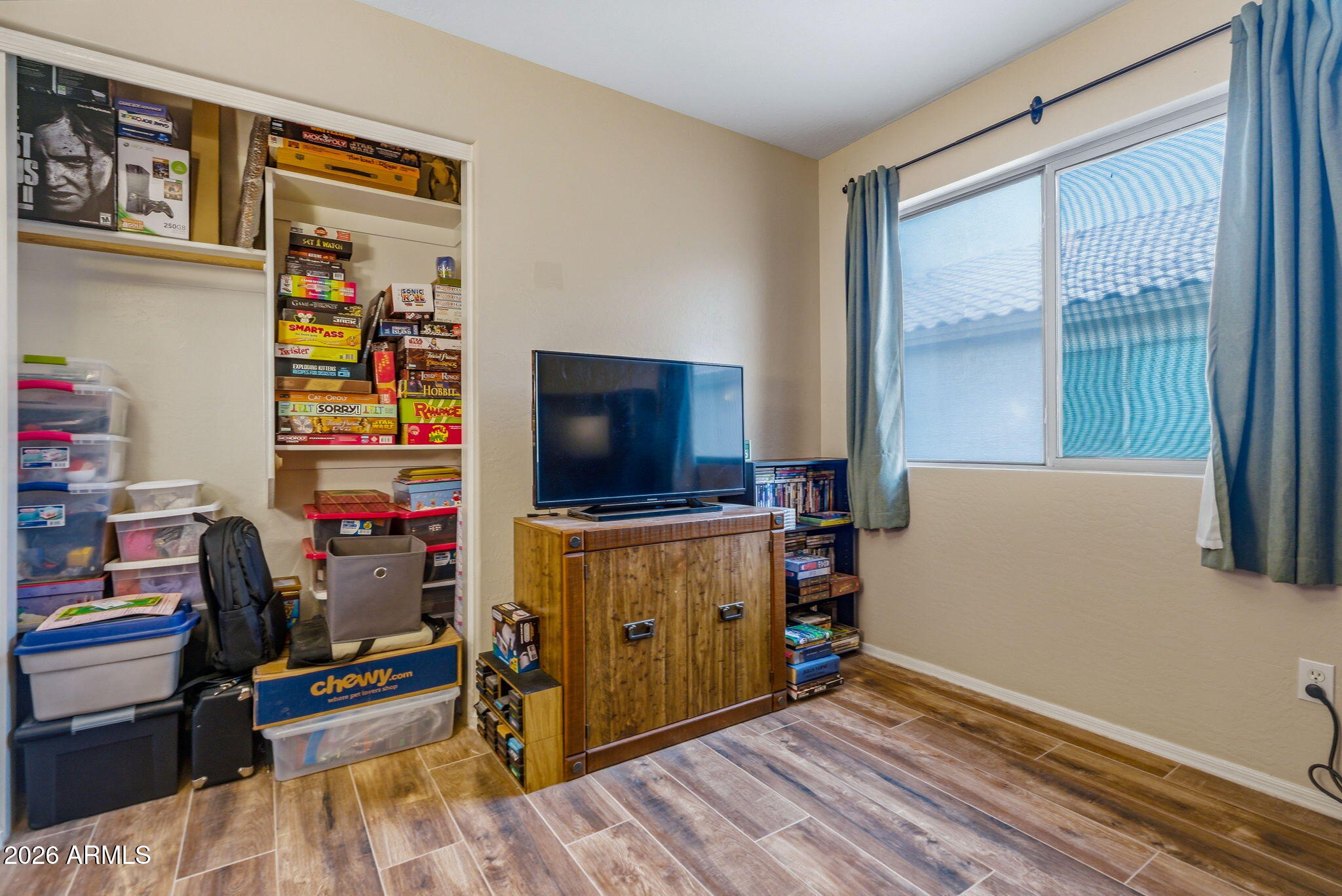 15843 West Washington Street Goodyear, AZ 85338 - Photo 23 of 39 a view of a workspace with furniture and a window