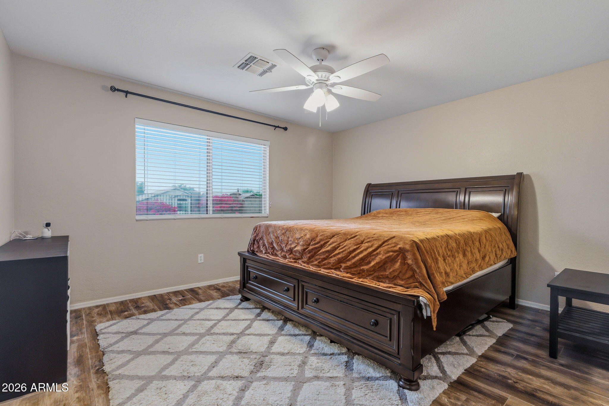15843 West Washington Street Goodyear, AZ 85338 - Photo 27 of 39 a large bed sitting in a bedroom next to a window