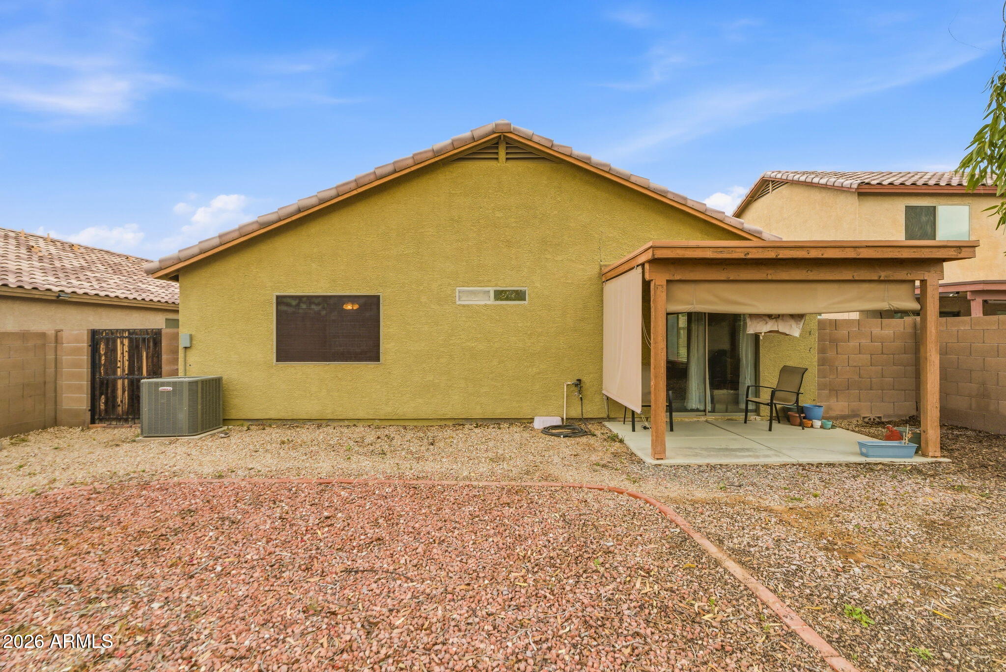 15843 West Washington Street Goodyear, AZ 85338 - Photo 33 of 39 a view of a house with a yard