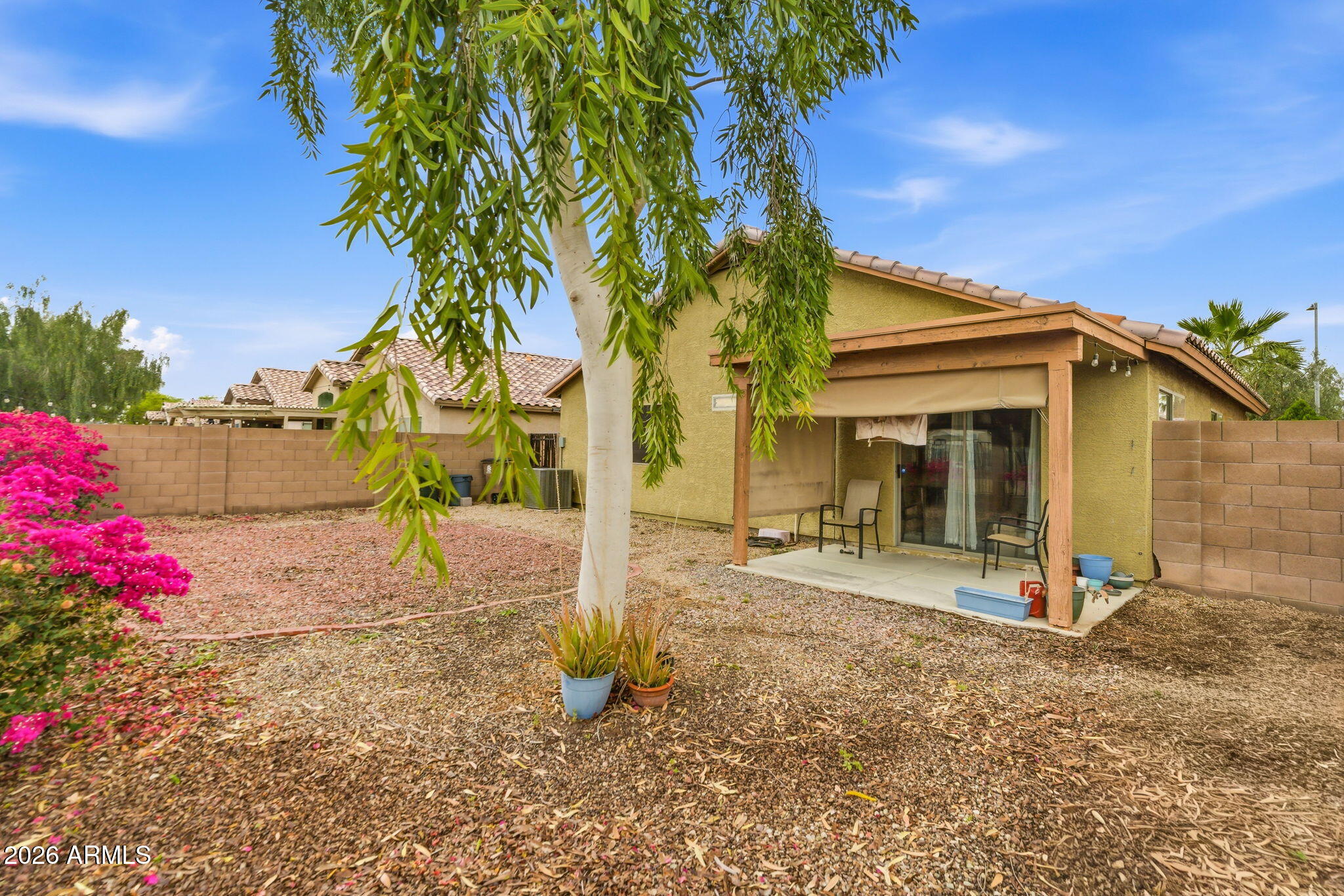 15843 West Washington Street Goodyear, AZ 85338 - Photo 37 of 39 a view of a house with backyard and tree