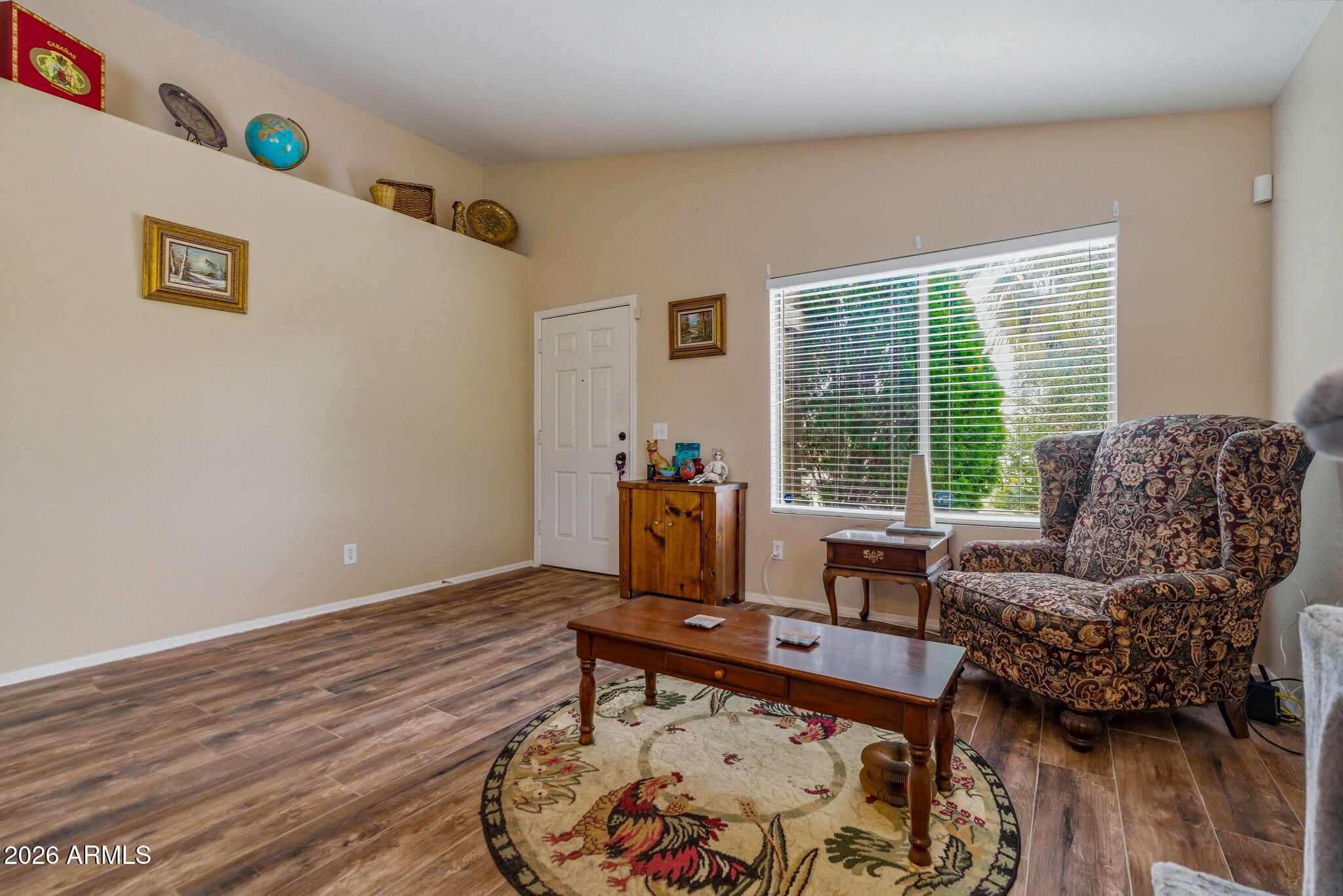 15843 West Washington Street Goodyear, AZ 85338 - Photo 4 of 39 a living room with furniture and a window