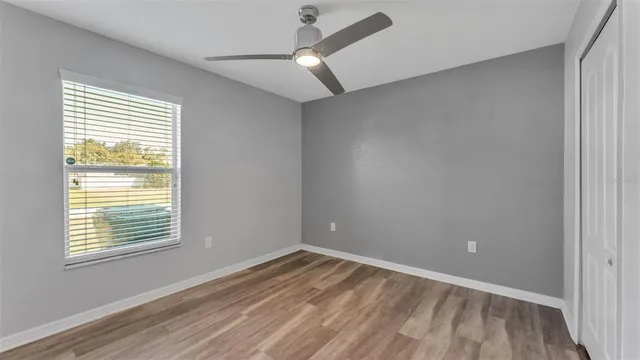 a view of an empty room and wooden floor