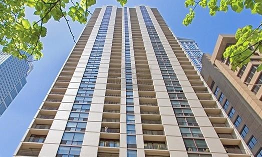200 North Dearborn Street, Unit 1901 Chicago, IL 60601 - Photo 1 of 24 a view of a balcony with wooden floor and fence