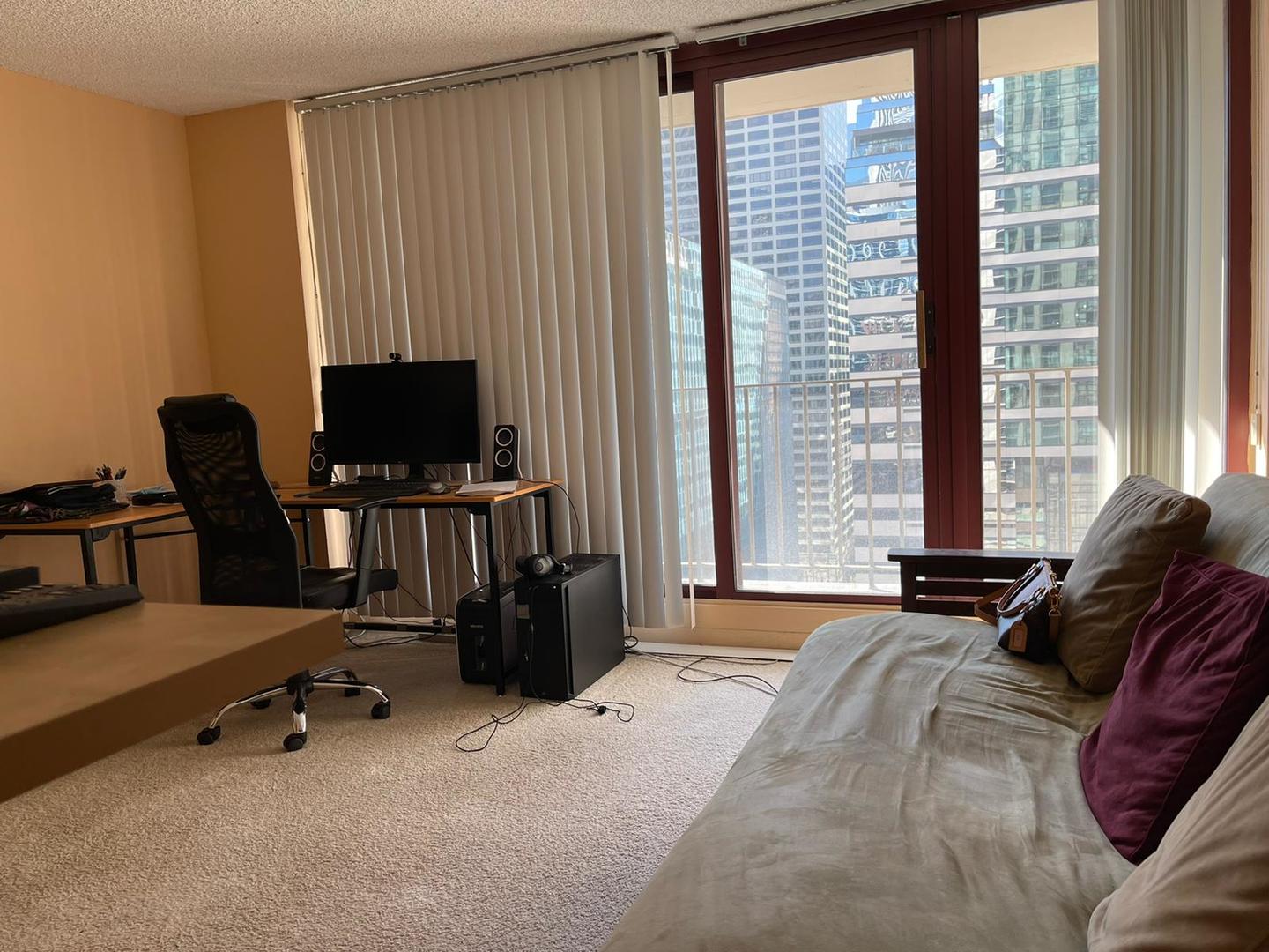 200 North Dearborn Street, Unit 1901 Chicago, IL 60601 - Photo 7 of 24 a view of a livingroom with workspace and a window