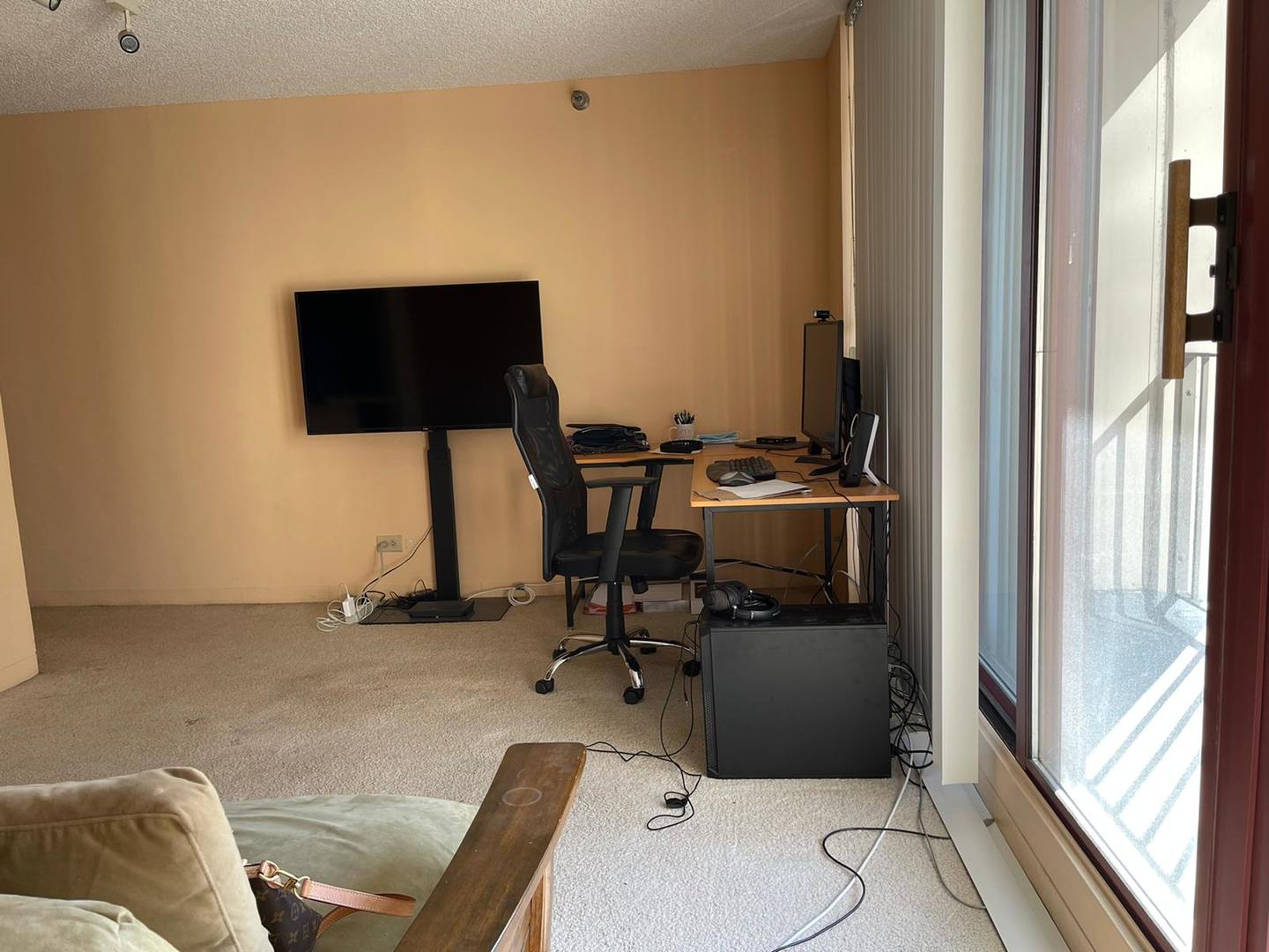 200 North Dearborn Street, Unit 1901 Chicago, IL 60601 - Photo 9 of 24 a living room with furniture and a flat screen tv