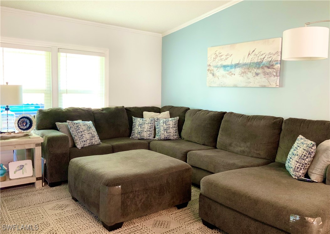 15550 Burnt Store Road, Unit 86 Punta Gorda, FL 33955 - Photo 13 of 36 a living room with couches and a large window