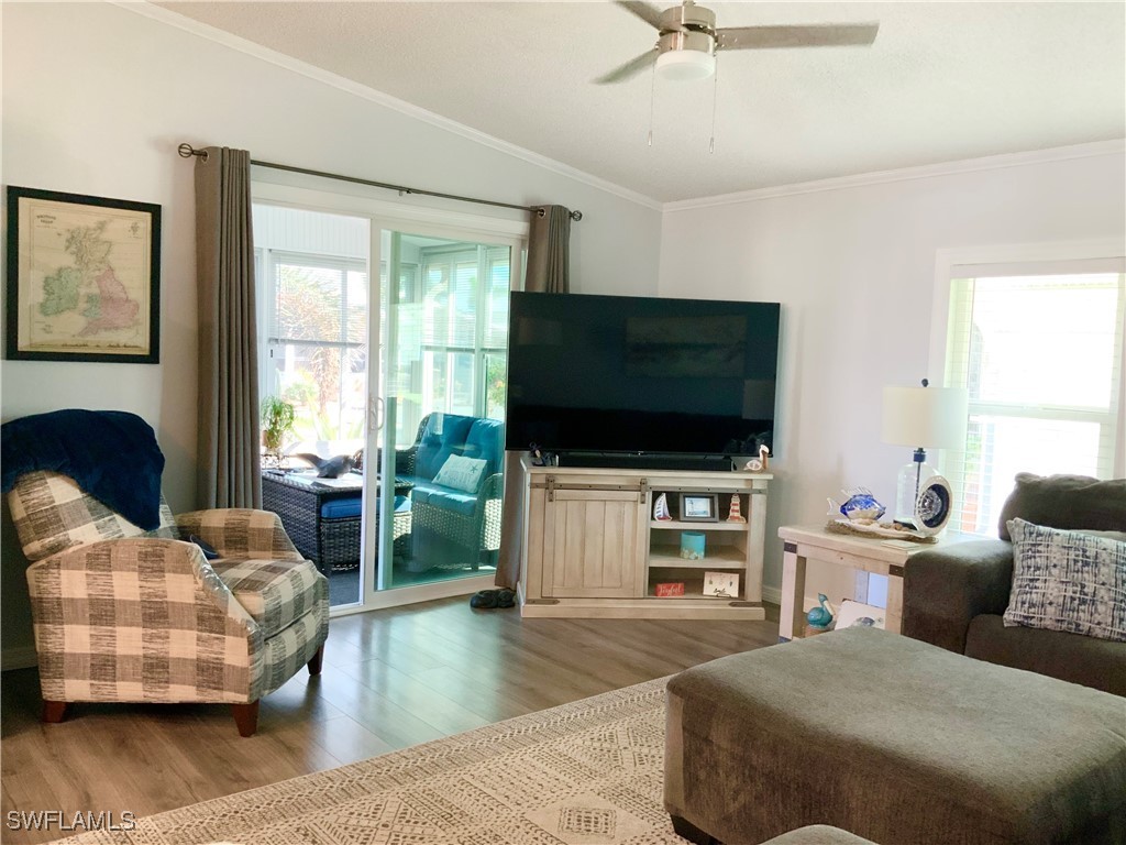 15550 Burnt Store Road, Unit 86 Punta Gorda, FL 33955 - Photo 14 of 36 a living room with furniture and a flat screen tv