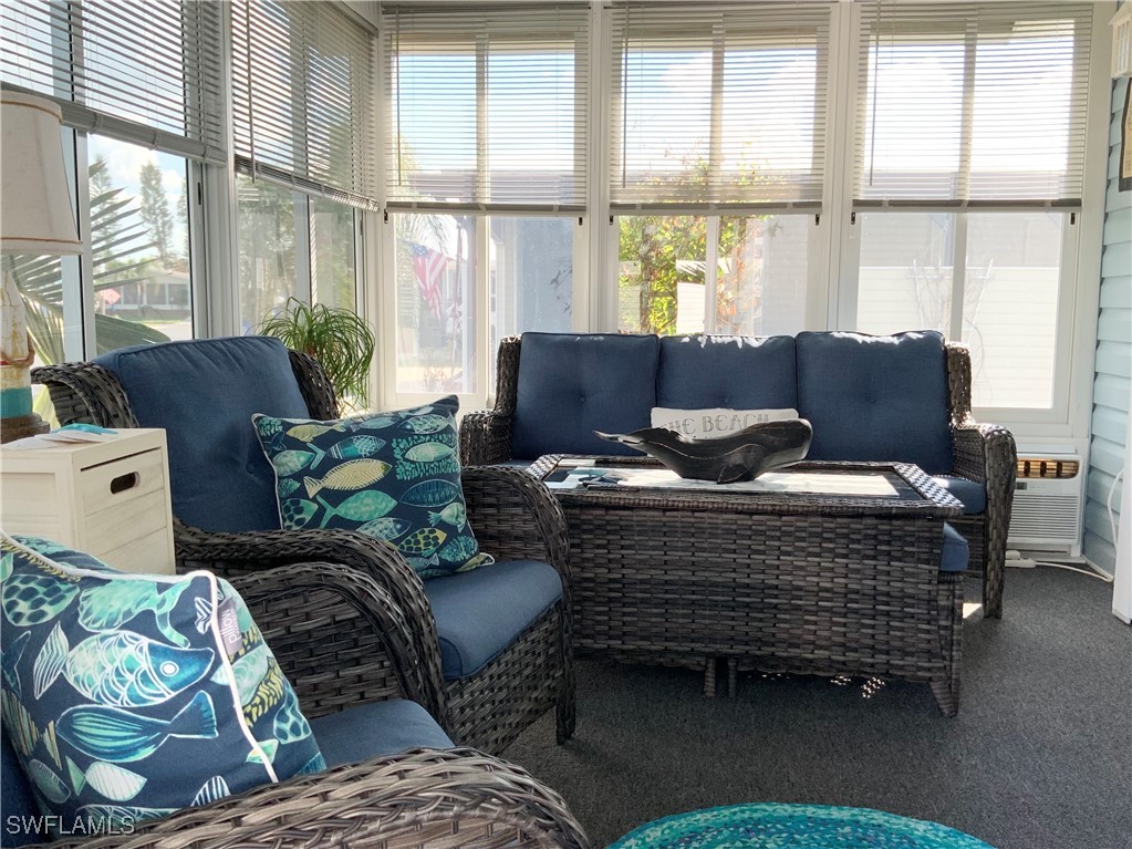 15550 Burnt Store Road, Unit 86 Punta Gorda, FL 33955 - Photo 16 of 36 a living room with furniture and windows