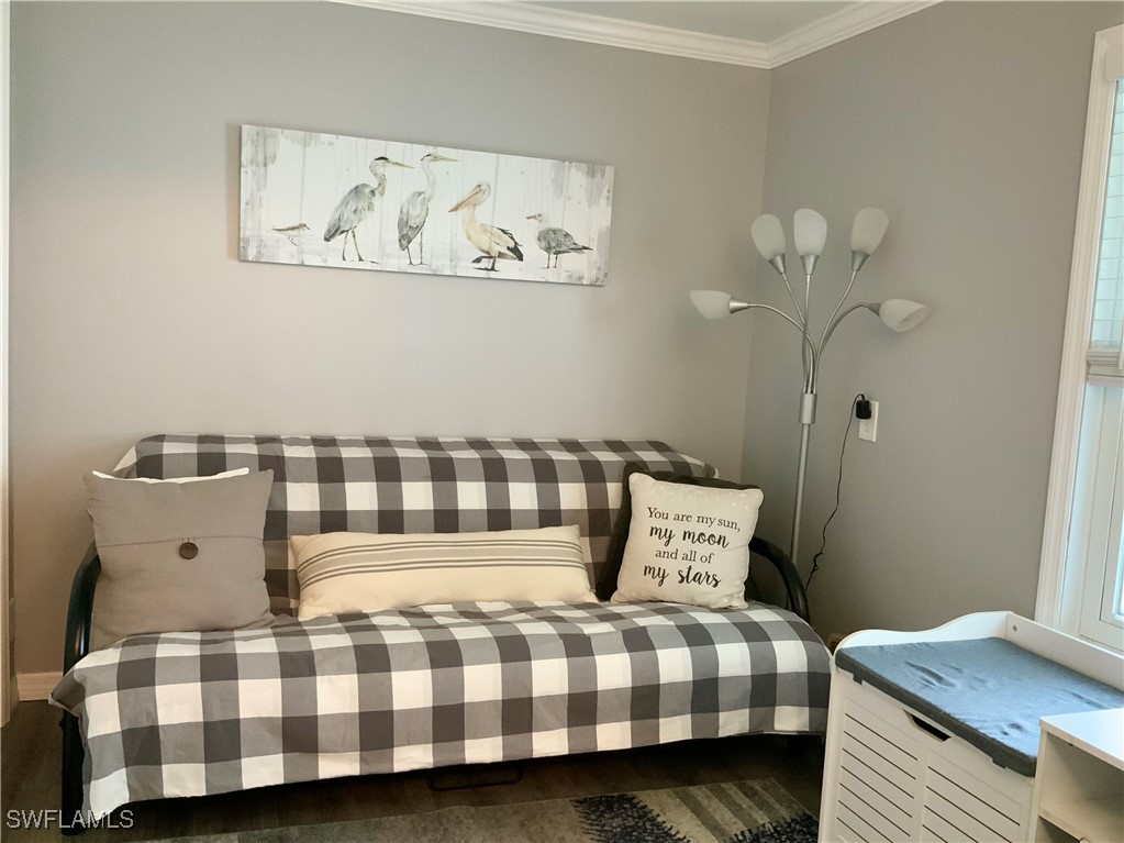 15550 Burnt Store Road, Unit 86 Punta Gorda, FL 33955 - Photo 19 of 36 a bedroom with a bed and painting on the wall