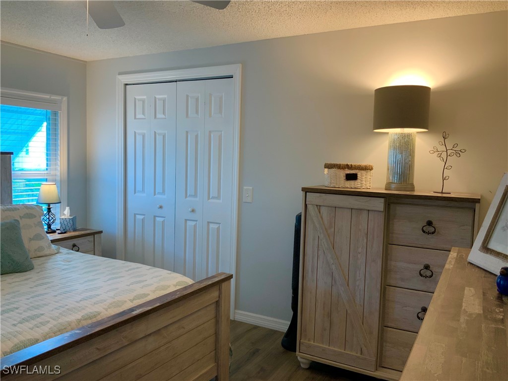 15550 Burnt Store Road, Unit 86 Punta Gorda, FL 33955 - Photo 24 of 36 a room with a sink a lamp and a dresser