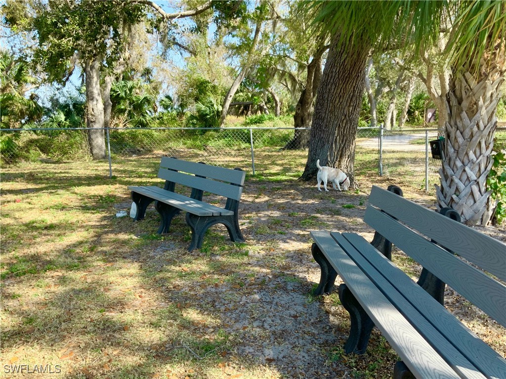 15550 Burnt Store Road, Unit 86 Punta Gorda, FL 33955 - Photo 30 of 36 a backyard of a house with outdoor seating