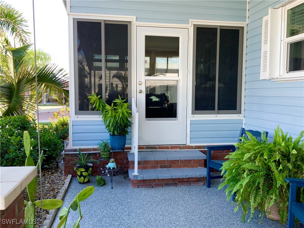 15550 Burnt Store Road, Unit 86 Punta Gorda, FL 33955 - Photo 3 of 36 a house view with a garden space