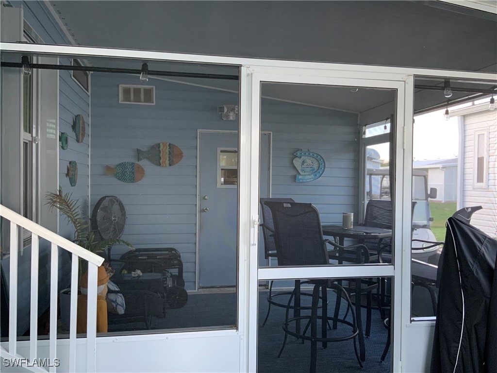15550 Burnt Store Road, Unit 86 Punta Gorda, FL 33955 - Photo 5 of 36 a bathroom with a granite countertop sink a mirror a vanity and shower