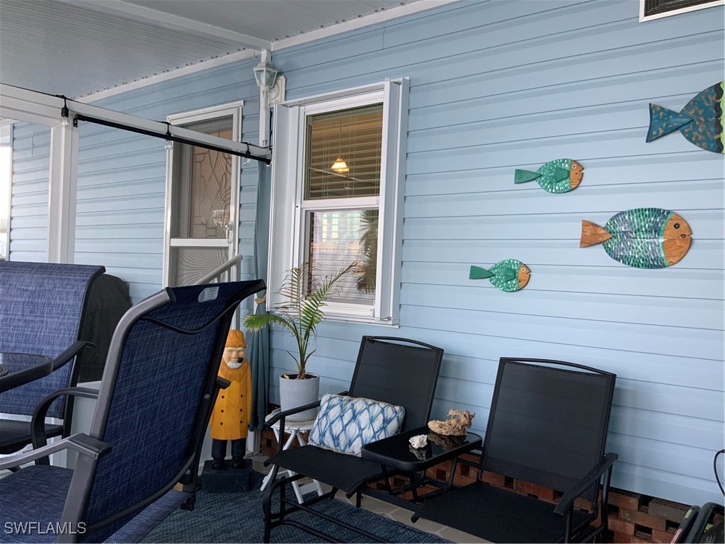 15550 Burnt Store Road, Unit 86 Punta Gorda, FL 33955 - Photo 6 of 36 a view of a workspace with furniture and a window