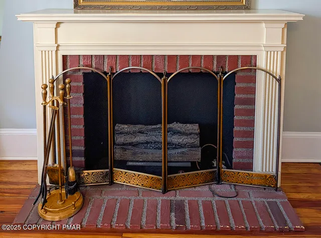 a view of front door with wooden door