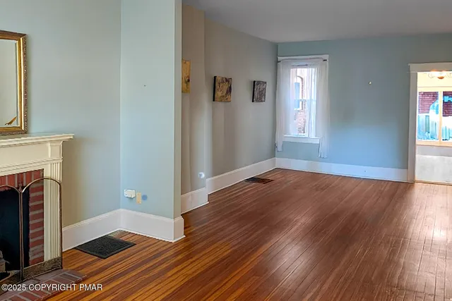 a view of livingroom with furniture and fireplace