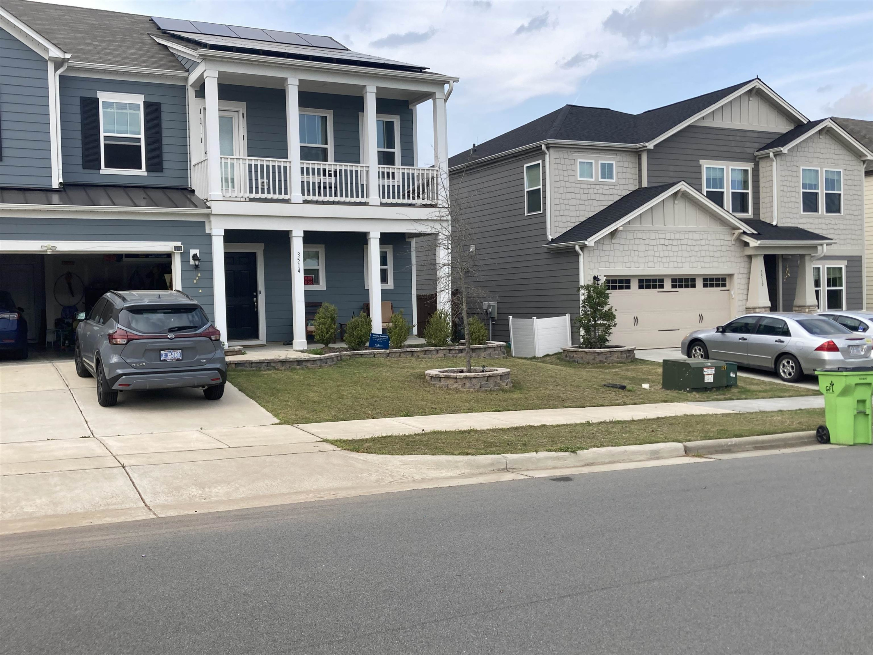 3514 Barn Road Apex, NC 27502 - Photo 12 of 53 a front view of a house with cars parked