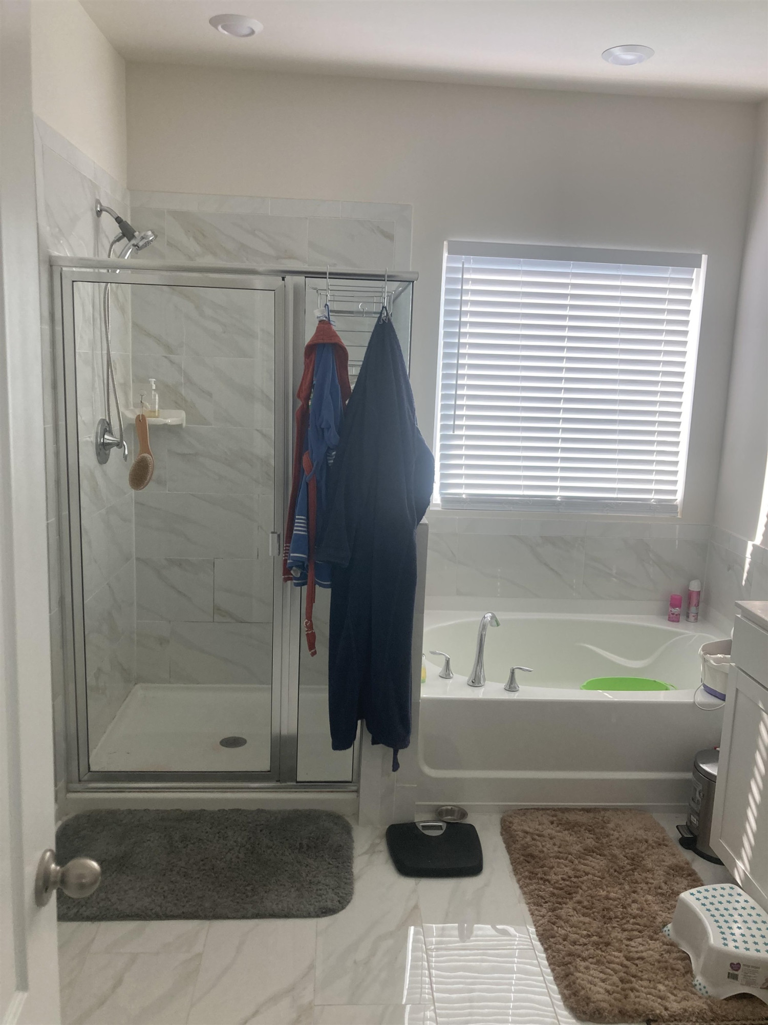 3514 Barn Road Apex, NC 27502 - Photo 32 of 53 a bathroom with a bathtub and a shower