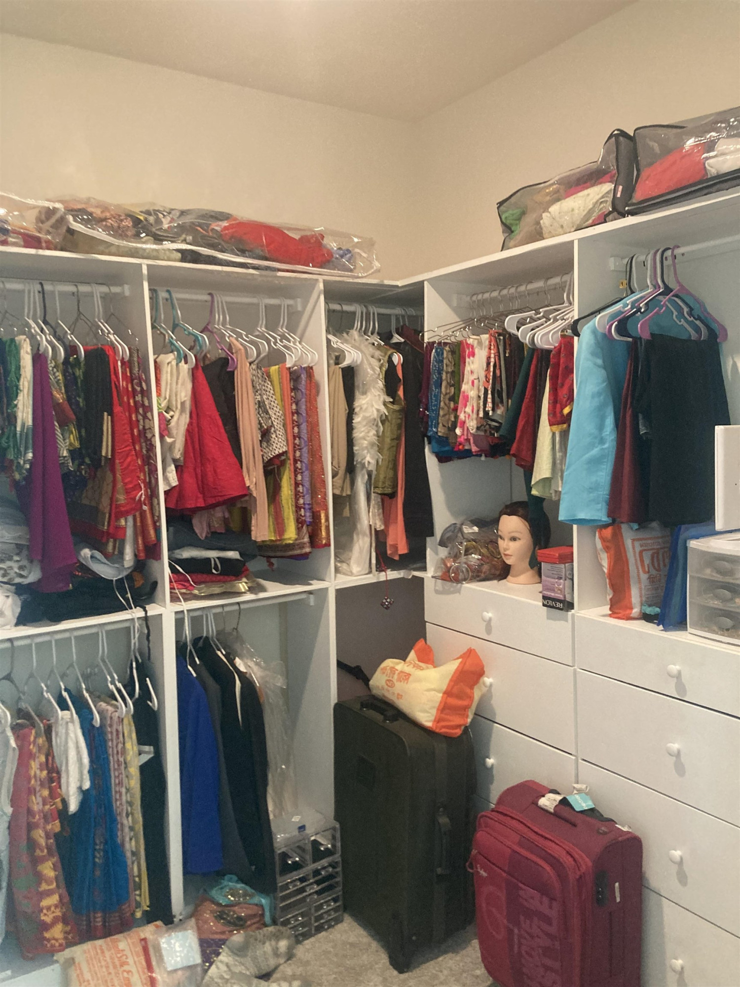 3514 Barn Road Apex, NC 27502 - Photo 33 of 53 a view of walk in closet with clothes and shoes