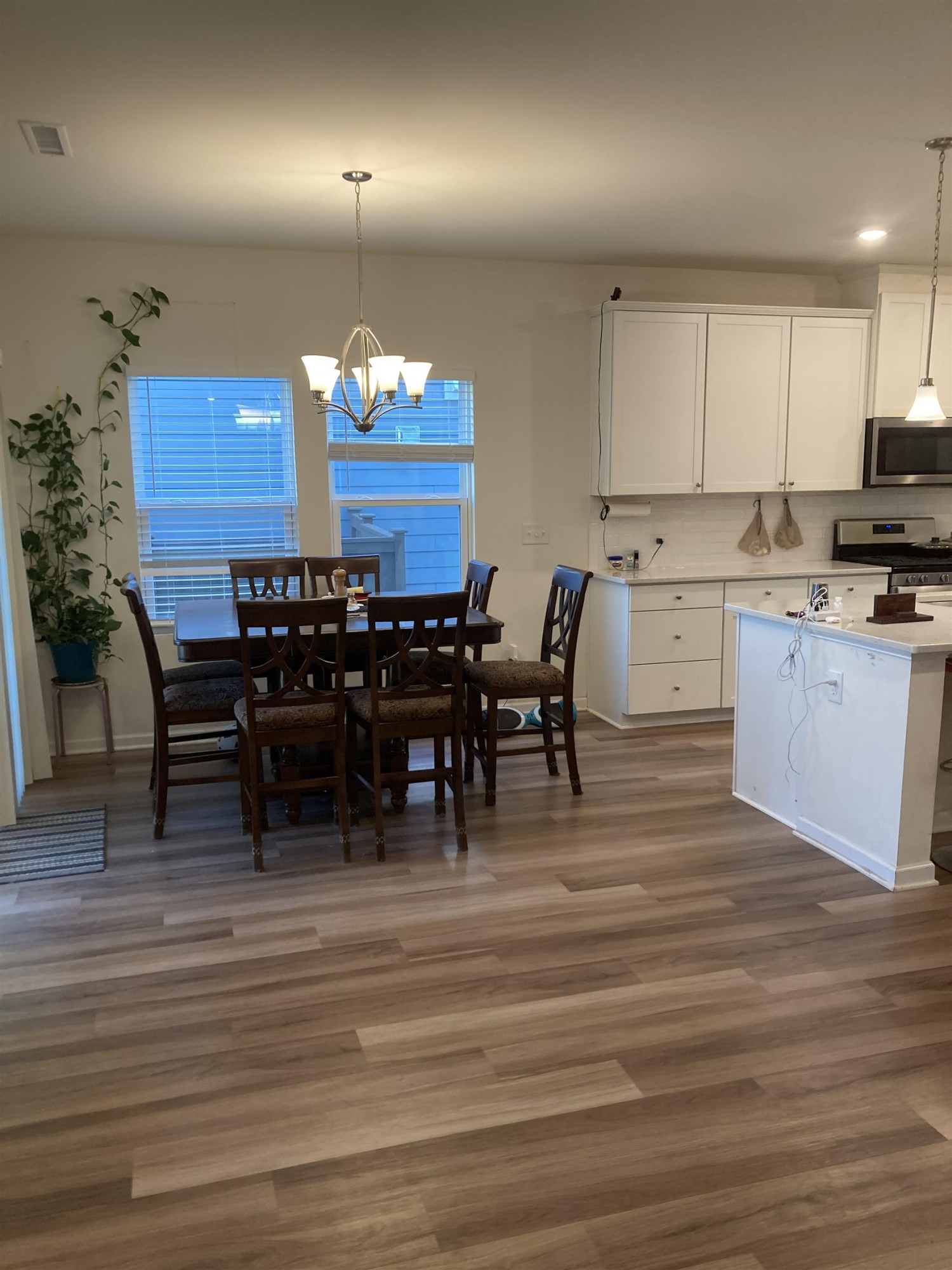3514 Barn Road Apex, NC 27502 - Photo 43 of 53 a view of a dining room with furniture and chandelier