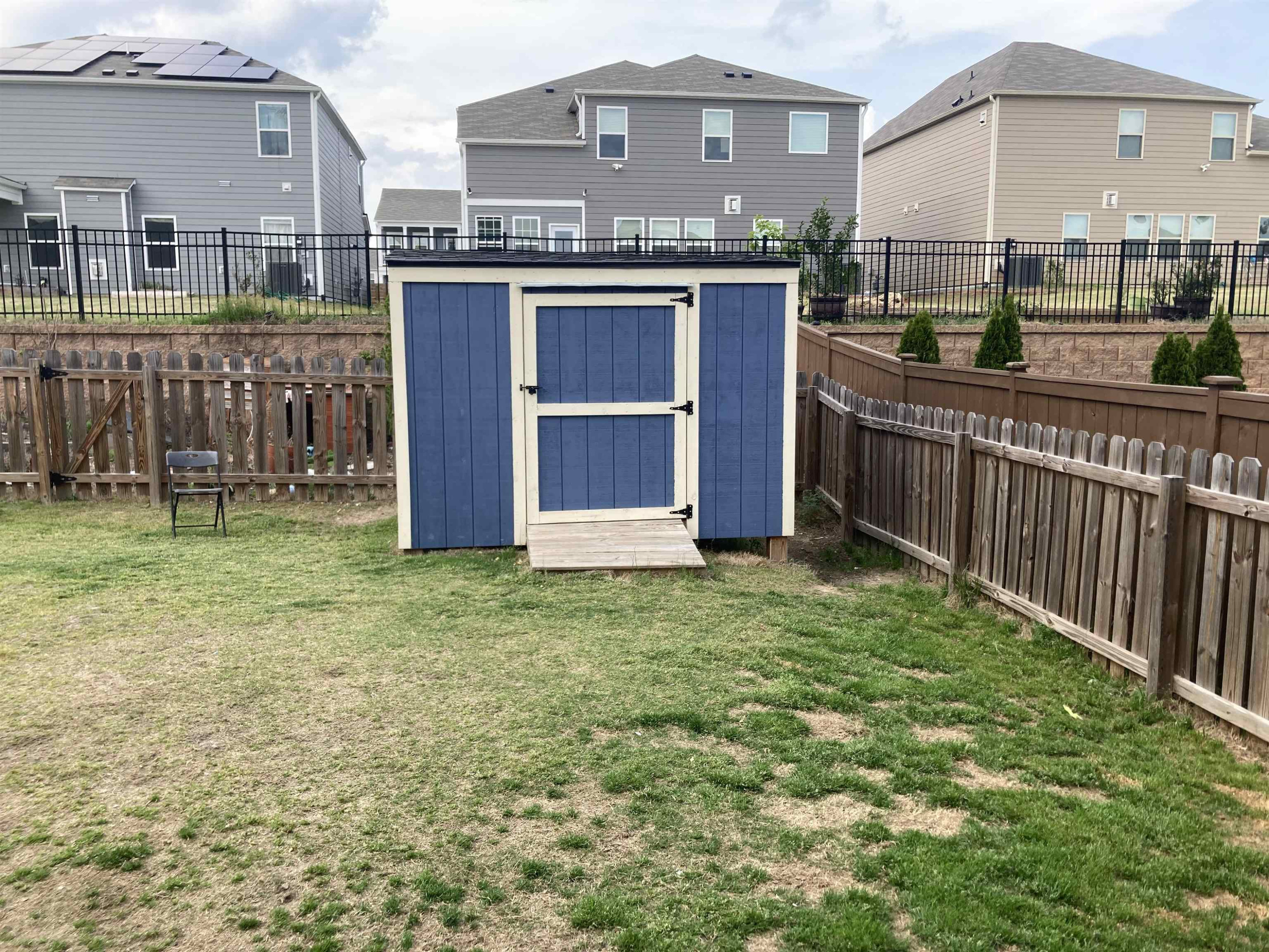 3514 Barn Road Apex, NC 27502 - Photo 6 of 53 a view of a house with a backyard and deck