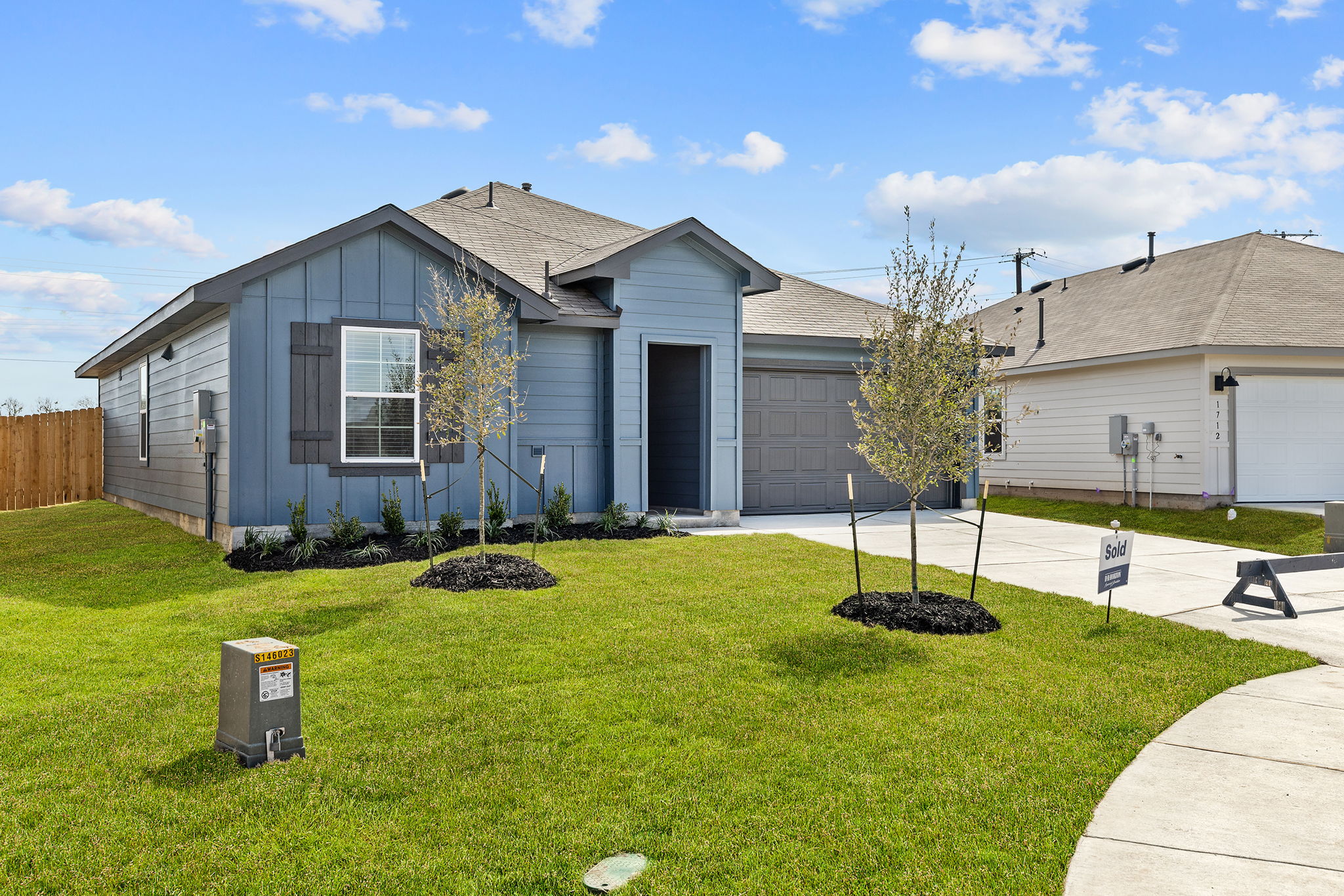 1702 Miller Terrace Lockhart, TX 78644 - Photo 1 of 21 a front view of a house with a garden