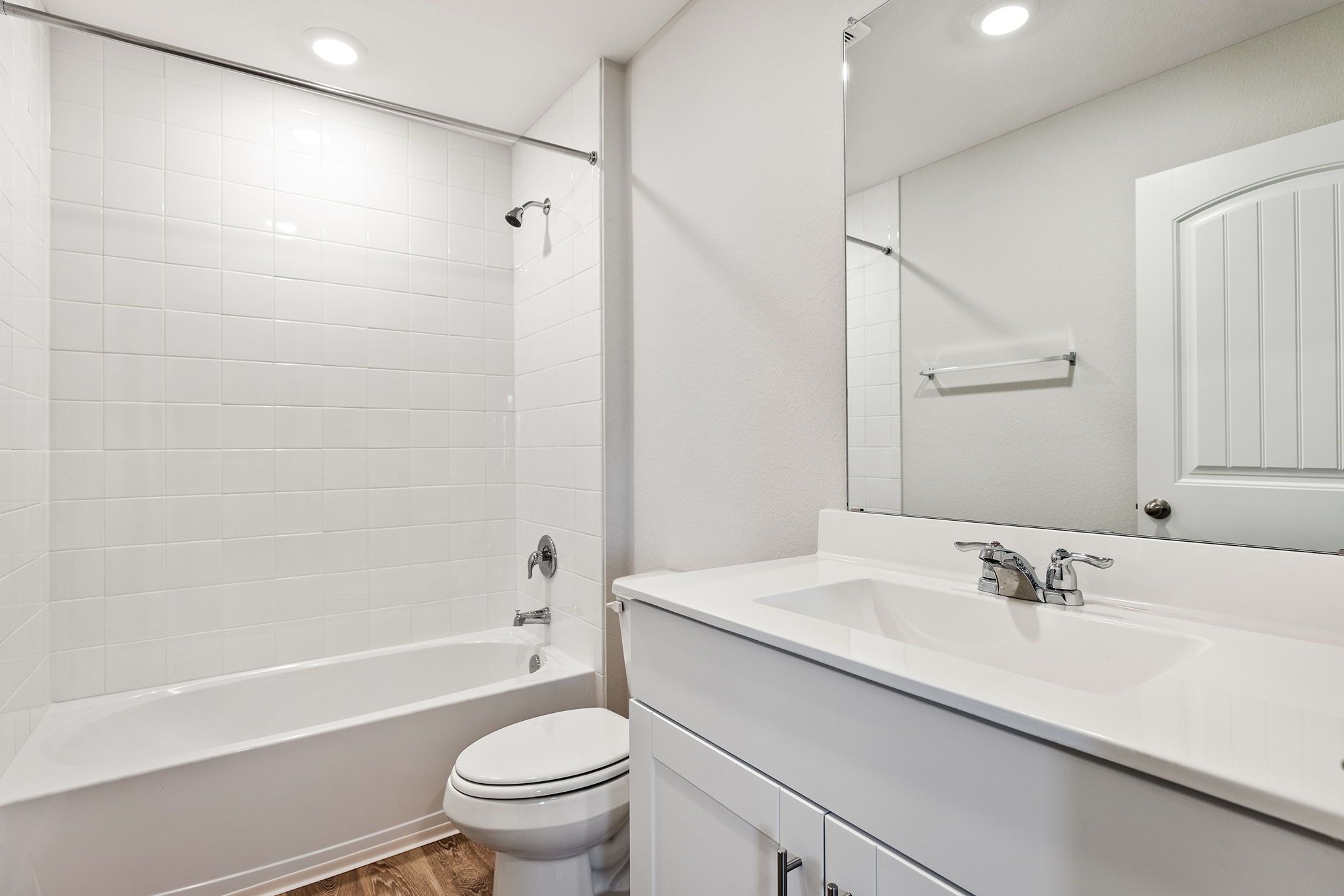 1702 Miller Terrace Lockhart, TX 78644 - Photo 17 of 21 a bathroom with a granite countertop sink a toilet and shower