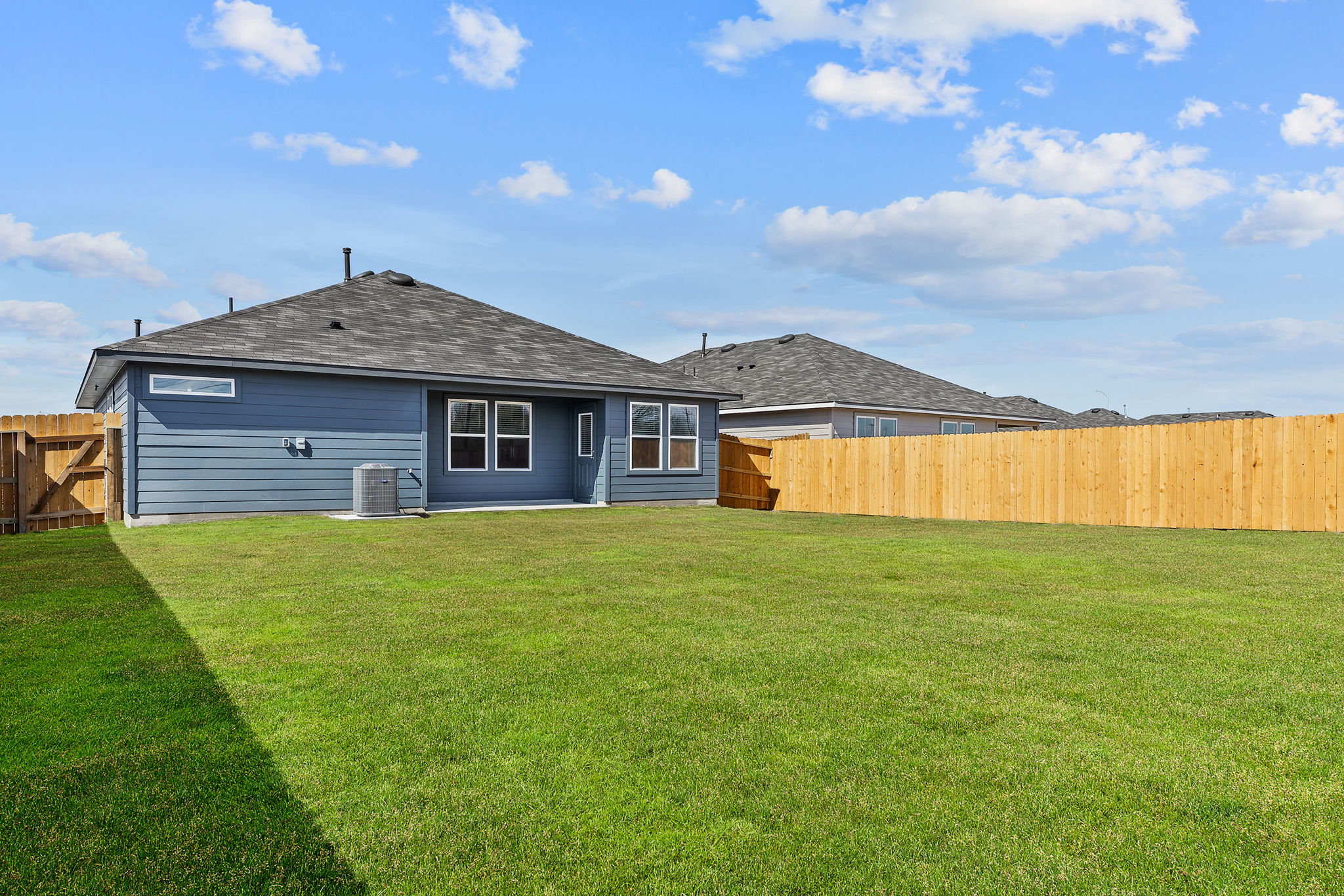 1702 Miller Terrace Lockhart, TX 78644 - Photo 21 of 21 a front view of a house with a garden