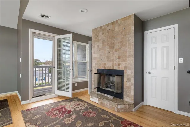 a bedroom with a bed and a fireplace