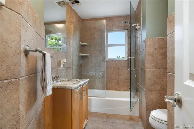 a bathroom with a tub a sink and shower