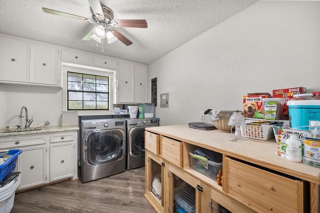 3748 Old Fort Worth Road Midlothian, TX 76065 - Photo 32 of 40 This the laundry room every family should have. It's the size of a bedroom! Approx 9' x 11'!! With sink, granite, and built in cabinets!