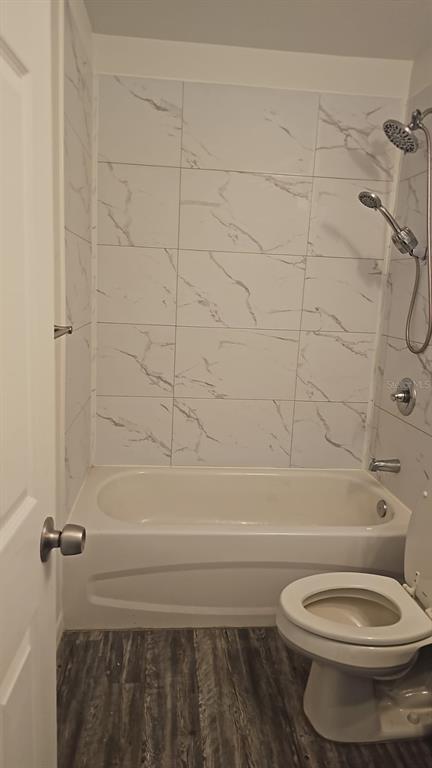 15028 Southwest 24th Place Ocala, FL 34481 - Photo 12 of 25 a bathroom with a toilet and a shower