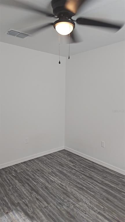 15028 Southwest 24th Place Ocala, FL 34481 - Photo 14 of 25 a view of a room with wooden floor and a table chair