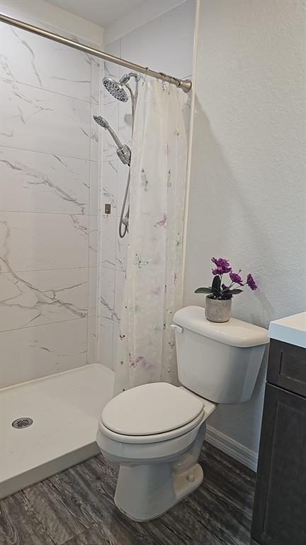 15028 Southwest 24th Place Ocala, FL 34481 - Photo 17 of 25 a white toilet sitting next to a bath tub shower