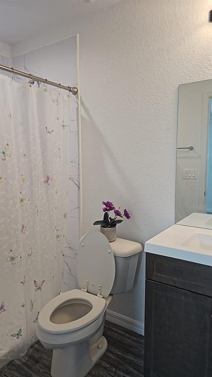 15028 Southwest 24th Place Ocala, FL 34481 - Photo 18 of 25 a bathroom with a toilet and a shower