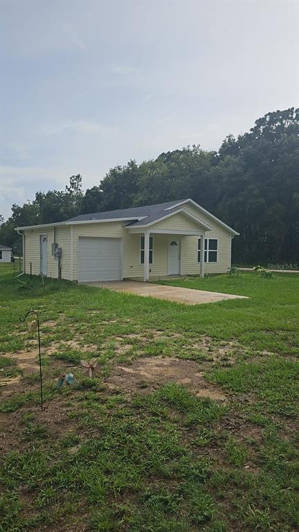 15028 Southwest 24th Place Ocala, FL 34481 - Photo 2 of 25 a house view with a garden space