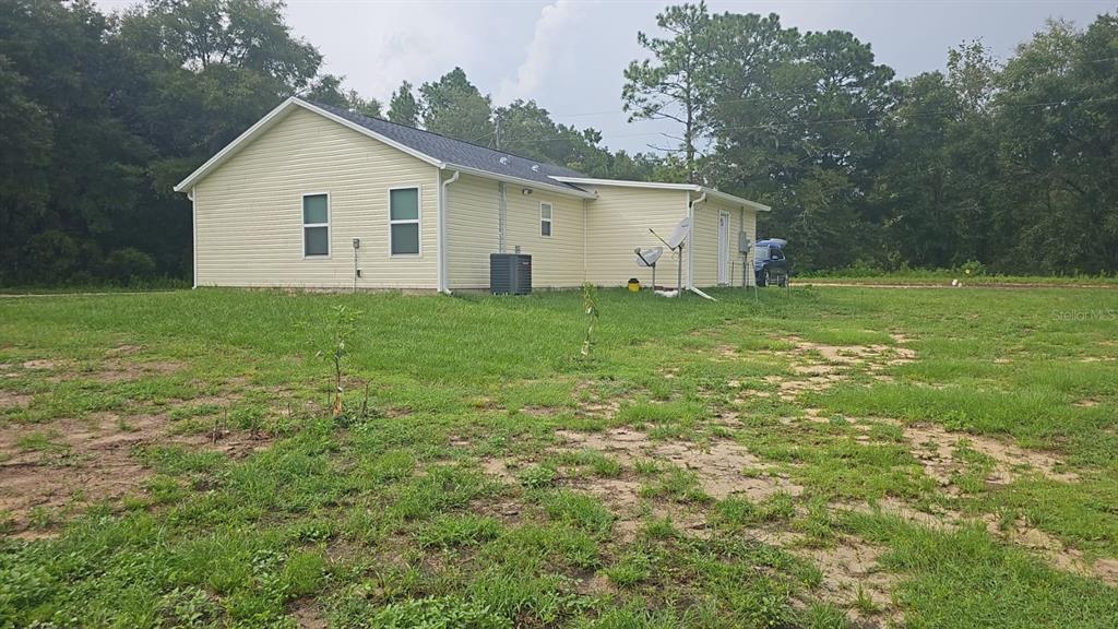 15028 Southwest 24th Place Ocala, FL 34481 - Photo 23 of 25 a view of a backyard with large trees
