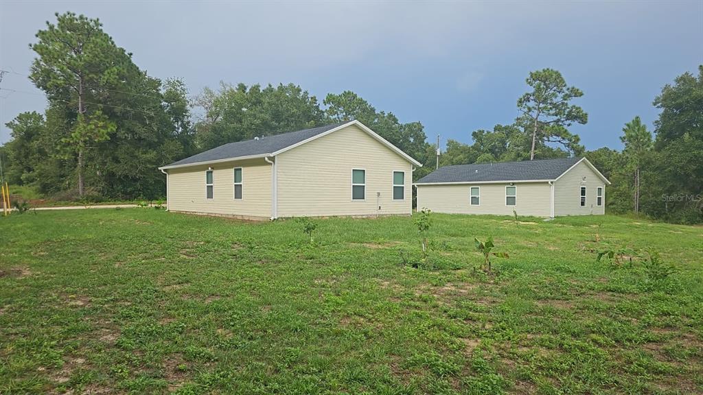15028 Southwest 24th Place Ocala, FL 34481 - Photo 24 of 25 a house view with a garden space