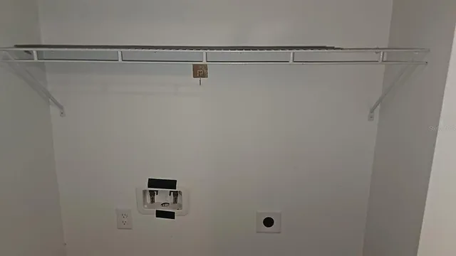 a view of a room with racks on the wall