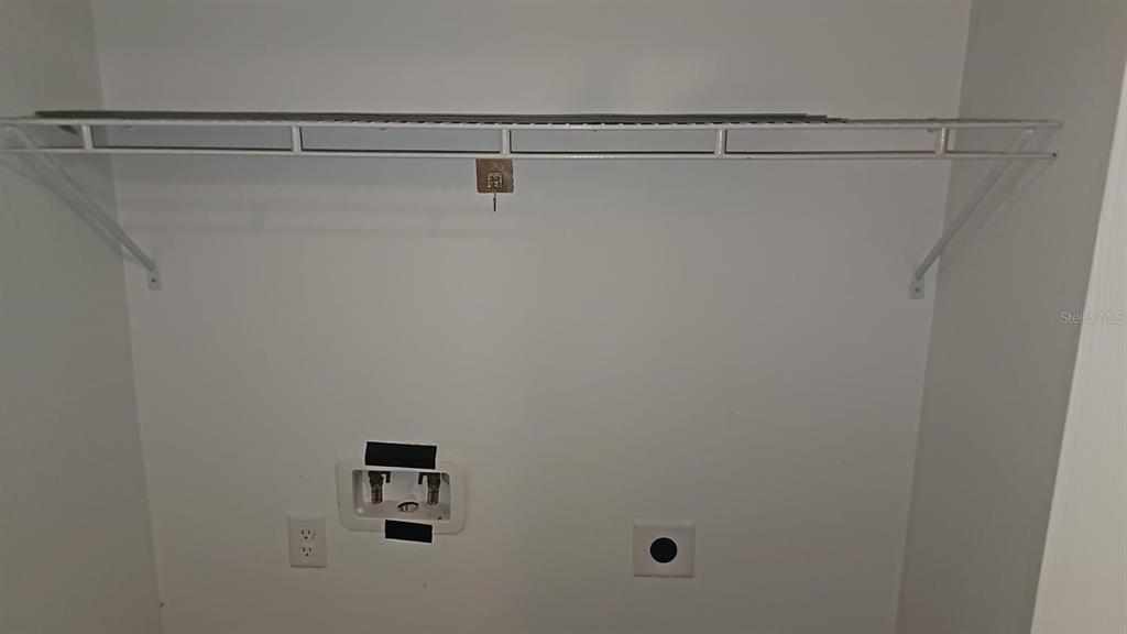 15028 Southwest 24th Place Ocala, FL 34481 - Photo 7 of 25 a view of a room with racks on the wall