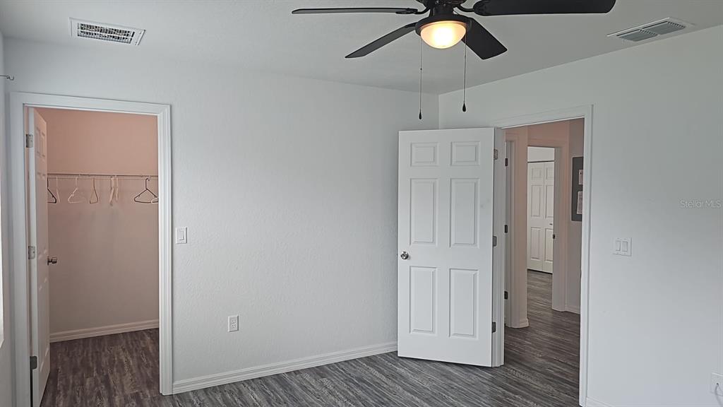 15028 Southwest 24th Place Ocala, FL 34481 - Photo 10 of 25 a view of empty room with wooden floor and window