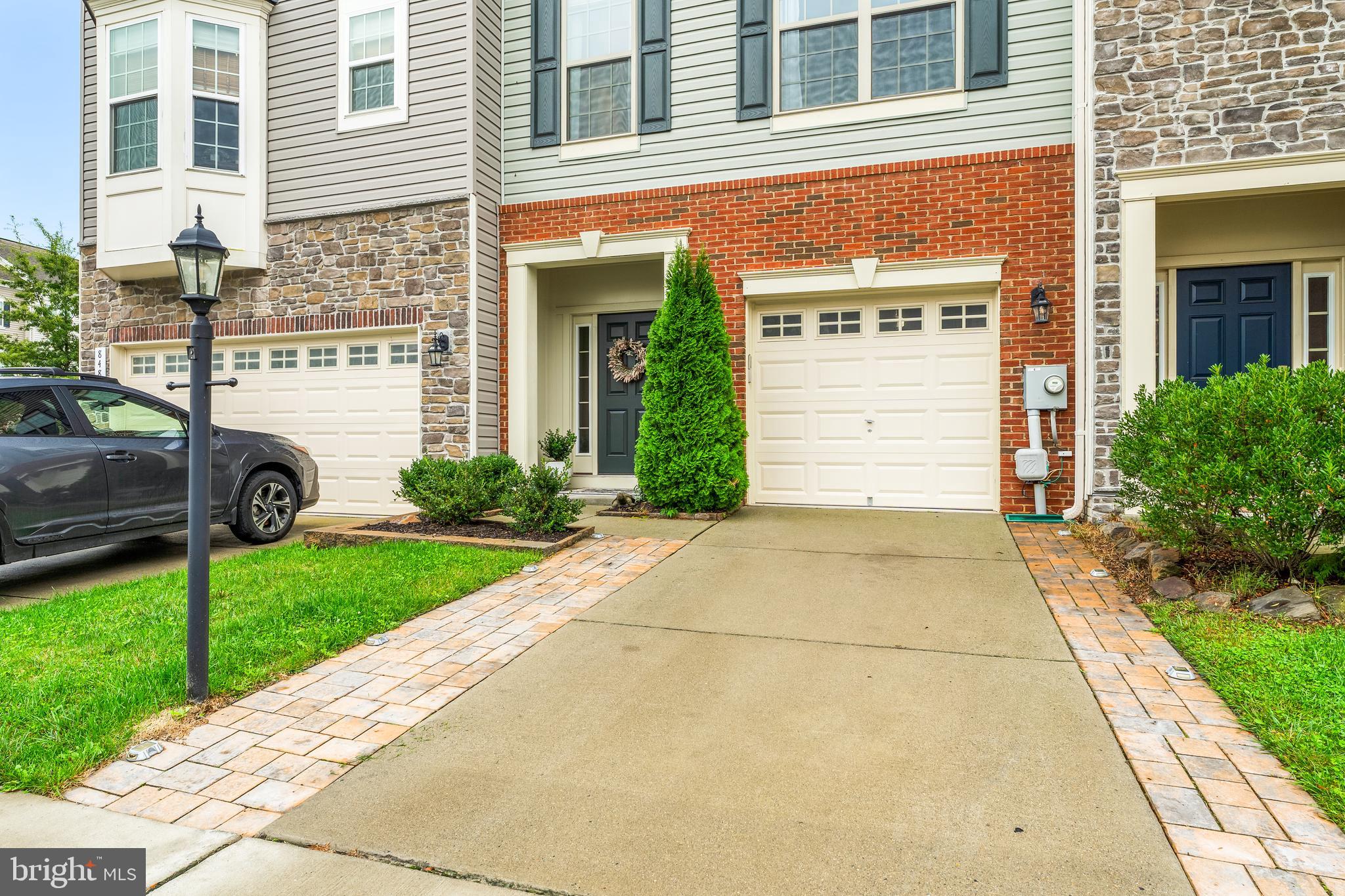 8479 Randell Ridge Road Frederick, MD 21704 - Photo 1 of 50 a front view of a house with a yard and garage