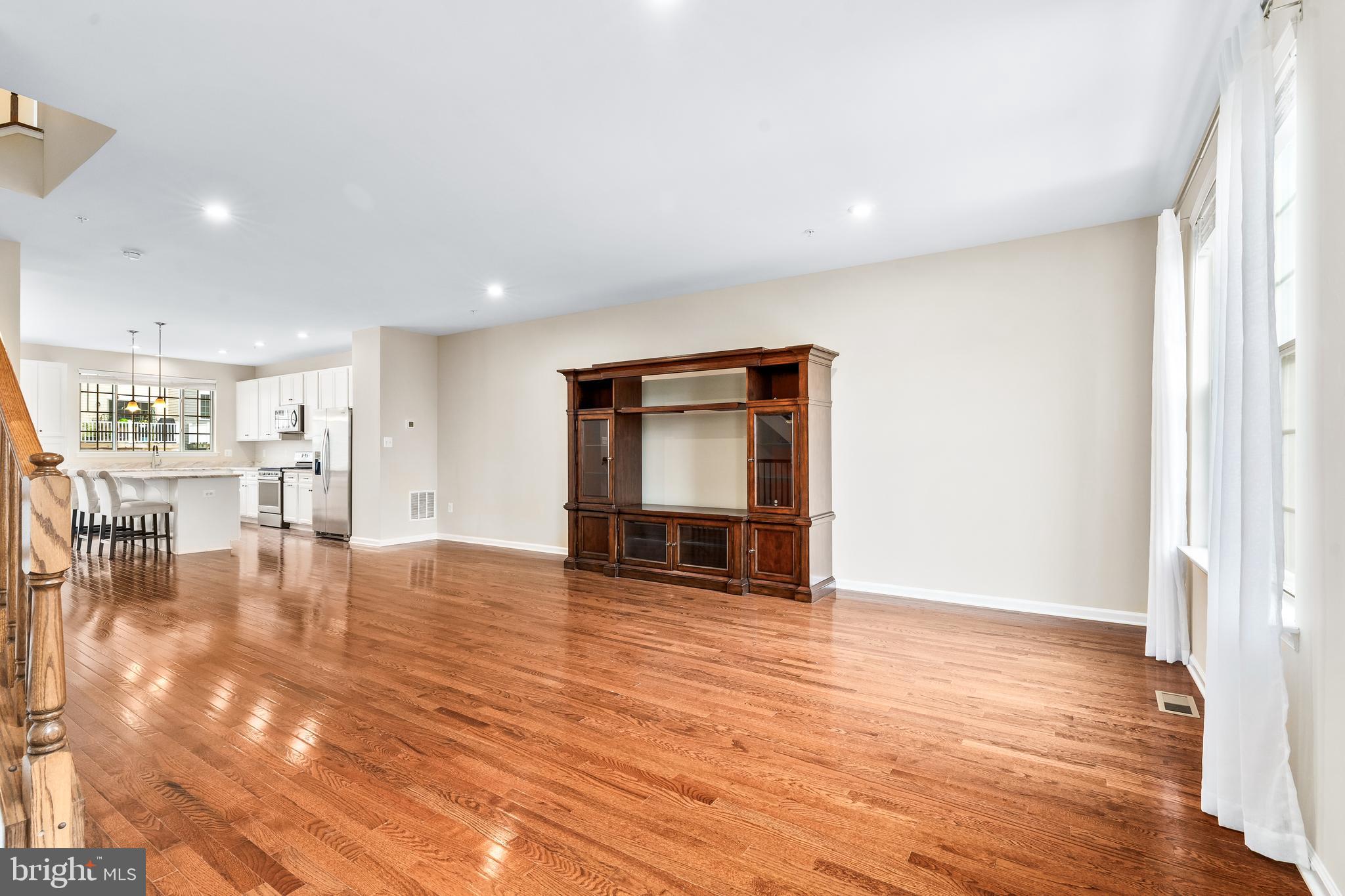 8479 Randell Ridge Road Frederick, MD 21704 - Photo 17 of 50 a view of an empty room with wooden floor and a window