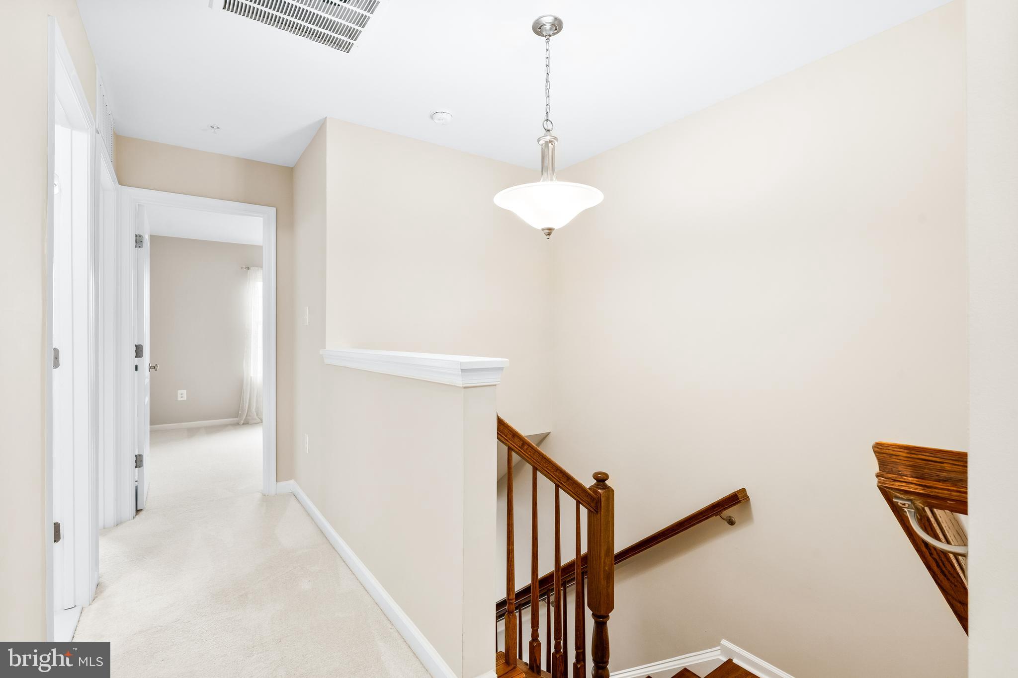 8479 Randell Ridge Road Frederick, MD 21704 - Photo 30 of 50 a view of a hallway with a white walls