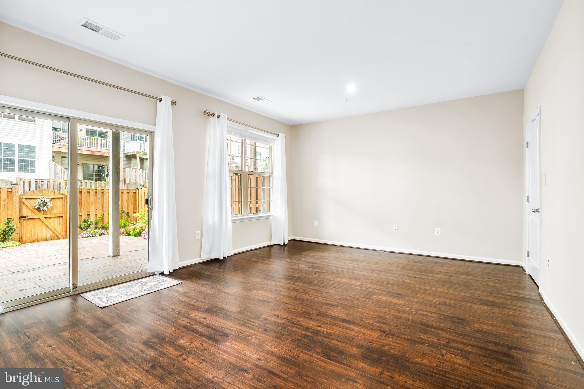 8479 Randell Ridge Road Frederick, MD 21704 - Photo 33 of 50 a view of an empty room with wooden floor and a window
