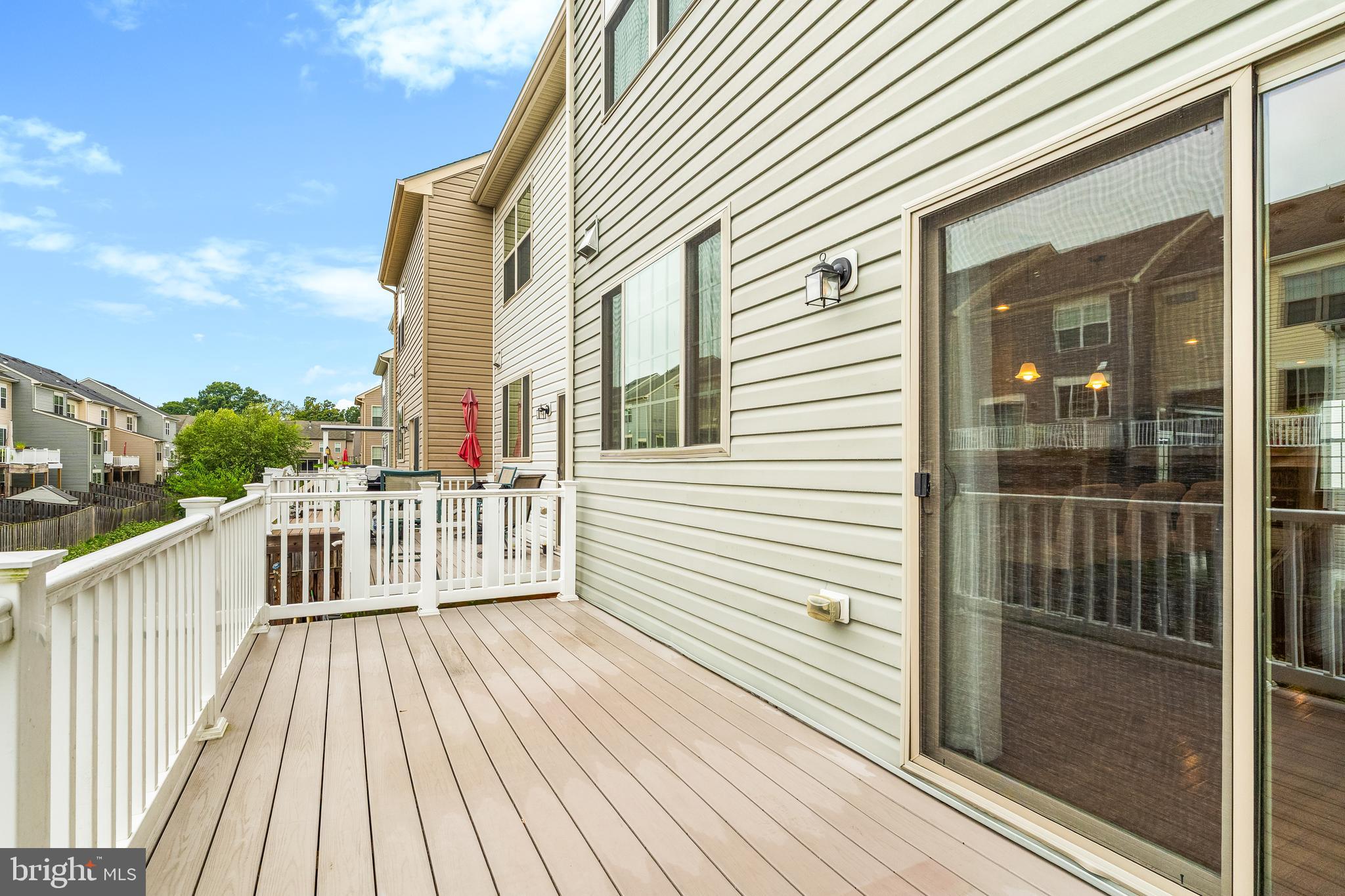 8479 Randell Ridge Road Frederick, MD 21704 - Photo 37 of 50 a view of a wooden deck with a floor to ceiling window