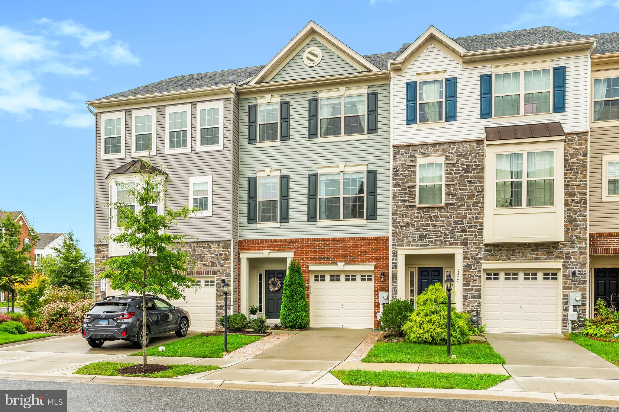 8479 Randell Ridge Road Frederick, MD 21704 - Photo 4 of 50 a front view of a residential apartment building with a yard and potted plants