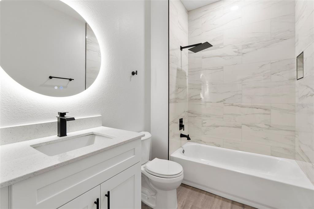 8264 Southwest 128th Terrace Dunnellon, FL 34432 - Photo 13 of 27 a bathroom with a sink a toilet and a mirror